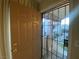 Apartment entry with security gate and brown door at 1333 Del Mar St # 202, Las Vegas, NV 89119