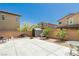 This home features a large patio, desert landscaping and block wall at 6409 Dundock Ave, Las Vegas, NV 89122