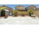 Large backyard featuring a patio, desert landscaping and block wall at 6409 Dundock Ave, Las Vegas, NV 89122