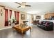 Inviting living room connects to dining area, with large windows and ample space at 6409 Dundock Ave, Las Vegas, NV 89122