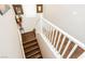 Staircase with wood floors and a white railing, leading to the upper level at 6409 Dundock Ave, Las Vegas, NV 89122