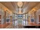 An opulent lobby with marble floors, intricate stonework, and multiple crystal chandeliers at 9103 Alta Dr # 401, Las Vegas, NV 89145