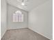 Spacious bedroom with ceiling fan and window at 3825 Pink Frost Dr, North Las Vegas, NV 89032