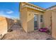 The backyard is equipped with brick and a door leading into the home at 1065 Admiral Emblem St, Henderson, NV 89015