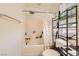 Bathroom with shower-tub combo, tile surround, and granite vanity at 1065 Admiral Emblem St, Henderson, NV 89015