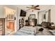 Bedroom featuring a bed, ceiling fan, dresser, and a doorway to an en-suite bathroom at 1065 Admiral Emblem St, Henderson, NV 89015