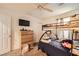 Cozy bedroom featuring a sturdy bunk bed, dresser with mounted TV, and neutral decor at 1065 Admiral Emblem St, Henderson, NV 89015