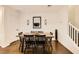 Dining area features wooden floors, a dining table, and modern decor at 1065 Admiral Emblem St, Henderson, NV 89015