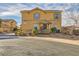 Two-story home with desert landscaping, shuttered windows, and a welcoming covered porch at 1065 Admiral Emblem St, Henderson, NV 89015