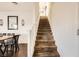 Carpeted staircase with a modern white railing at 1065 Admiral Emblem St, Henderson, NV 89015