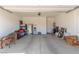 Spacious garage interior featuring concrete flooring with ample storage and organization possibilities at 10254 Baronia St, Las Vegas, NV 89141