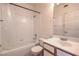 Bright bathroom features a tiled shower-tub combination and a modern single sink vanity at 4960 Harrison Dr # 214, Las Vegas, NV 89120