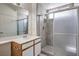 Updated bathroom with modern tiled shower, glass door, and a single vanity at 4960 Harrison Dr # 214, Las Vegas, NV 89120
