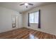 Vaulted ceiling in empty bedroom offering natural light, hardwood floors, and ensuite bathroom access at 4960 Harrison Dr # 214, Las Vegas, NV 89120