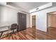 Bedroom with hardwood floors and a murphy bed that folds away to save space at 4960 Harrison Dr # 214, Las Vegas, NV 89120