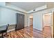 Bedroom showcasing modern design with a concealed murphy bed and dedicated workspace at 4960 Harrison Dr # 214, Las Vegas, NV 89120