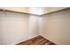 Walk-in closet featuring wood-look floors and ample hanging storage at 4960 Harrison Dr # 214, Las Vegas, NV 89120