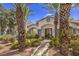 Inviting clubhouse entrance with landscaped walkway, offering a glimpse of community amenities at 4960 Harrison Dr # 214, Las Vegas, NV 89120