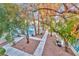 Aerial view of a community pool surrounded by trees and pathways in a well-maintained area at 4960 Harrison Dr # 214, Las Vegas, NV 89120