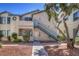 Charming apartment building with well-maintained landscaping and exterior staircase at 4960 Harrison Dr # 214, Las Vegas, NV 89120