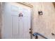 Close-up of front door featuring the unit number and exterior lighting at 4960 Harrison Dr # 214, Las Vegas, NV 89120