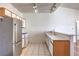 Efficient open kitchen featuring bright lighting and view into adjacent living area at 4960 Harrison Dr # 214, Las Vegas, NV 89120