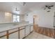 Bright kitchen boasts a breakfast bar overlooking the living area with updated dishwasher at 4960 Harrison Dr # 214, Las Vegas, NV 89120