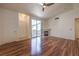 Living room with hardwood floors, a fireplace, and sliding door access to a private outdoor patio at 4960 Harrison Dr # 214, Las Vegas, NV 89120