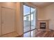 Living area features a fireplace, access to the patio, and tile and wood floors at 4960 Harrison Dr # 214, Las Vegas, NV 89120