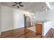 Open living room with wood floors and an eat-in kitchen at 4960 Harrison Dr # 214, Las Vegas, NV 89120