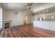 Bright living room features vaulted ceiling, ceiling fan, fireplace, and open layout at 4960 Harrison Dr # 214, Las Vegas, NV 89120