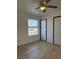 Spacious bedroom with large window and ceiling fan at 5121 Lindell Rd # 104, Las Vegas, NV 89118