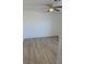 Bright bedroom with ceiling fan and wood-look floors at 5121 Lindell Rd # 104, Las Vegas, NV 89118