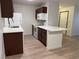 Well-equipped kitchen with white cabinetry and quartz countertops at 5121 Lindell Rd # 104, Las Vegas, NV 89118