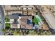 Aerial view showcasing a luxurious home with a pool, basketball court, and meticulously landscaped grounds at 1 Olympia Canyon Way, Las Vegas, NV 89141