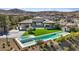 Aerial view of stunning home showcasing a pool, backyard, and mountain views at 1 Olympia Canyon Way, Las Vegas, NV 89141