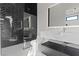 Beautiful bathroom showcasing a glass shower with black tile, marble countertop, and modern fixtures at 1 Olympia Canyon Way, Las Vegas, NV 89141