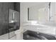 Sleek bathroom with marble countertop, modern fixtures, glass shower, and stylish gray tile at 1 Olympia Canyon Way, Las Vegas, NV 89141