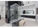 Spa-like bathroom with a glass-enclosed shower, custom storage, and sleek fixtures for a luxurious experience at 1 Olympia Canyon Way, Las Vegas, NV 89141
