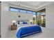 Bright bedroom featuring modern style and a large windows showing outdoor landscape at 1 Olympia Canyon Way, Las Vegas, NV 89141