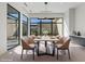 Contemporary dining room with stylish light fixture and large windows at 1 Olympia Canyon Way, Las Vegas, NV 89141