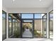 Bright and airy entrance with glass doors leading to a landscaped courtyard at 1 Olympia Canyon Way, Las Vegas, NV 89141