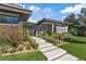 Attractive modern home featuring a stone facade and manicured landscaping at 1 Olympia Canyon Way, Las Vegas, NV 89141