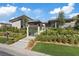 Beautiful home with lush landscaping and a modern gated entrance at 1 Olympia Canyon Way, Las Vegas, NV 89141