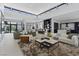 Expansive living room with soaring ceilings, clerestory windows, open layout, and seamless kitchen integration at 1 Olympia Canyon Way, Las Vegas, NV 89141