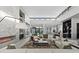 Spacious living room with fireplace, clerestory windows, and open layout creates an airy, modern atmosphere at 1 Olympia Canyon Way, Las Vegas, NV 89141