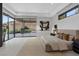 Bright main bedroom with views of the backyard, modern furnishings, and neutral tones for a peaceful atmosphere at 1 Olympia Canyon Way, Las Vegas, NV 89141