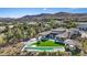Aerial view of a stunning property with a pool, spa, basketball court, and landscaped backyard at 1 Olympia Canyon Way, Las Vegas, NV 89141