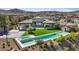 Luxury home with a large swimming pool, spa, basketball court, and beautifully landscaped backyard at 1 Olympia Canyon Way, Las Vegas, NV 89141