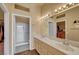 Bathroom boasts dual sinks, marble countertops, and a shower at 9833 Villa Ridge Dr, Las Vegas, NV 89134